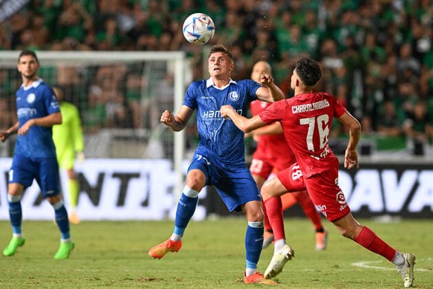 Gent s Alessio Castro-Montes and Omonia s Charalambos Charalambous fight for the ball during a soccer game between Cypriot Omonia Nicosia and Belgian KAA Gent in Nicosia, Cyprus on Thursday 25 August 2022, the return leg of the play-offs for the UEFA Europa League competition. DAVIDxCATRY  x40934390x