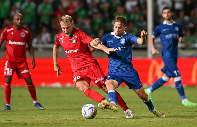 Omonia s Roman Bezus and Gent s Andrew Hjulsager fight for the ball during a soccer game between Cypriot Omonia Nicosia and Belgian KAA Gent in Nicosia, Cyprus on Thursday 25 August 2022, the return leg of the play-offs for the UEFA Europa League competition. DAVIDxCATRY  x40935967x