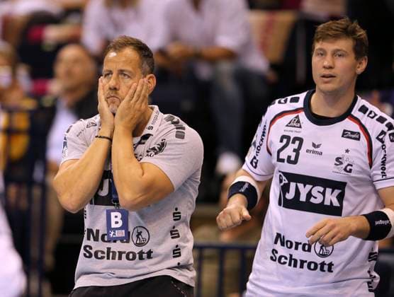 Photo skeptical expression at coach Maik Machulla Flensburg and right Goran Sogard Johannessen handball men on 01 09 2022 1 Bundesliga HSV Hamburg SG Flensburg 30 31