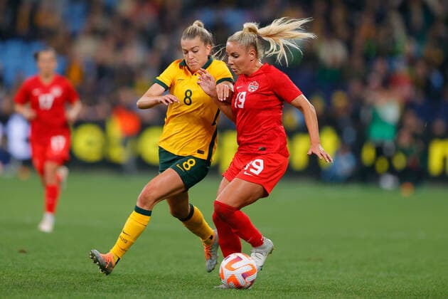 Adriana Leon of Canada attacks but is tackled by Charlotte Grant of Matildas during the Women s Friendly match between CommBank Matildas (Australia Women) and Canada Women at Allianz Stadium, Sydney, Australia on 6 September 2022. Copyright: xPeterxDovganx 33080026