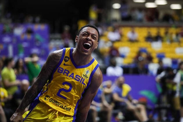 (220911) -- RECIFE, Sept. 11, 2022 -- Yago Santos of Brazil celebrates after scoring during a semifinal match between Brazil and Canada at the FIBA Americup 2022 in Recife, Brazil, Sept. 10, 2022. ) (SP)BRAZIL-RECIFE-BASKETBALL-FIBA AMERICUP-BRAZIL VS CANADA WangxTiancong 