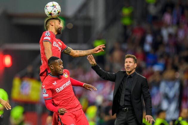 Soccer Champions League, 2022 2023 season, matchday 2, Bayer 04 Leverkusen Atletico Madrid on 13 09 2022 in Leverkusen North Rhine Westphalia Leverkusen s Kerem Demirbay Leverkusen s Moussa Diaby header duel, Atletico s head coach Diego Simeone looks on, Copyright: xKirchnerx xChristopherxNeundorfx