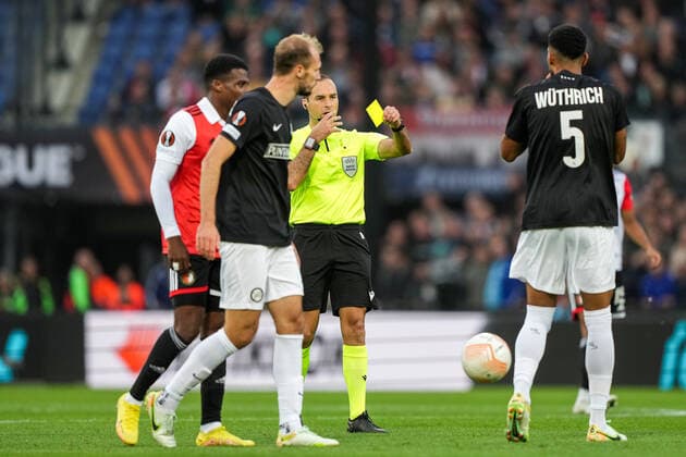 UEFA Europa League: Feyenoord v SK Sturm Graz Rotterdam - Referee Jerome Brisard gives Alexandar Borkovic of Strum Graz a yellow card during the match between Feyenoord v SK Sturm Graz at Stadion Feijenoord De Kuip on 15 September 2022 in Rotterdam, Netherlands. Copyright: xTomxBodex