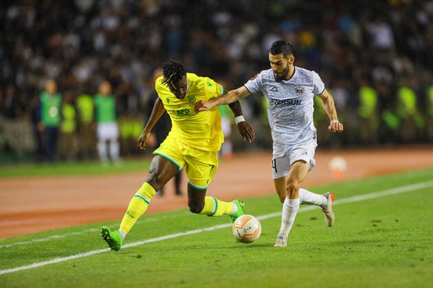 Elvin Jafarguliyev 44 of Qarabag and Evan Guessand 7 of Nantes during the UEFA Europa League group G match between Qarabag FK and FC Nantes at Tofig Bahramov Stadium on September 15, 2022 in Baku, Azerbaijan. Copyright: xAzizxKarimovx qarabag-nants1