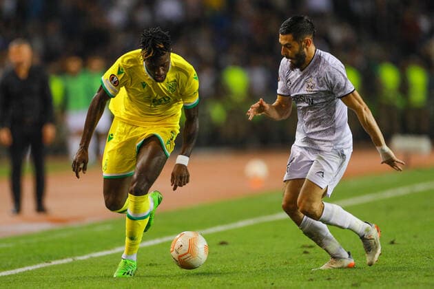 Elvin Jafarguliyev 44 of Qarabag and Evan Guessand 7 of Nantes during the UEFA Europa League group G match between Qarabag FK and FC Nantes at Tofig Bahramov Stadium on September 15, 2022 in Baku, Azerbaijan. Copyright: xAzizxKarimovx qarabag-nants2
