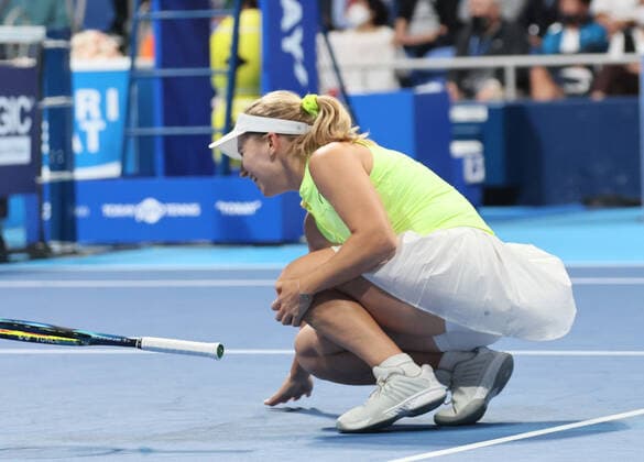 September 20, 2022, Tokyo, Japan - Daria Saville of Australia holds her left knee as she collapses after she hits the ball against Japan s Naomi Osaka at the singles first round match at the Toray Pan Pacific Open tennis tournament at the Ariake Coliseum in Tokyo on Tuesday, September 20, 2022. Saville retired the game as her left knee injury and Osaka advanced to the second round. Noxthirdxpartyxsales  (199076131)
