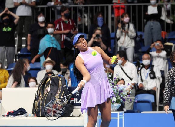 September 20, 2022, Tokyo, Japan - Naomi Osaka of Japan hits the ball with her autograph to the stand as Australia s Daria Saville left the game for injury at the singles first round match at the Toray Pan Pacific Open tennis tournament at the Ariake Coliseum in Tokyo on Tuesday, September 20, 2022. Saville retired the game as her left knee injury and Osaka advanced to the second round. Noxthirdxpartyxsales  (199076175)