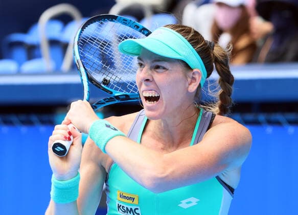 September 21, 2022, Tokyo, Japan - Despina Papamichail of Greece returns the ball against Gabrine Muguruza of Spain at the singles second round match at the Toray Pan Pacific Open tennis tournament at the Ariake Coliseum in Tokyo on Wednesday, September 21, 2022. Third seeded Muguruza defeated Papamichail 6-4, 6-2. Noxthirdxpartyxsales  (199128253)