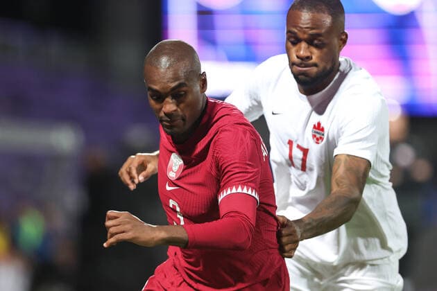 SOCCER - QAT vs CAN, test match VIENNA,AUSTRIA,23.SEP.22 - SOCCER - International test match, Qatar vs Canada. Image shows Abdulkarim Hassan Fadlalla (QAT) and Cyle Larin (CAN).  GEPAxpictures xArminxRauthner