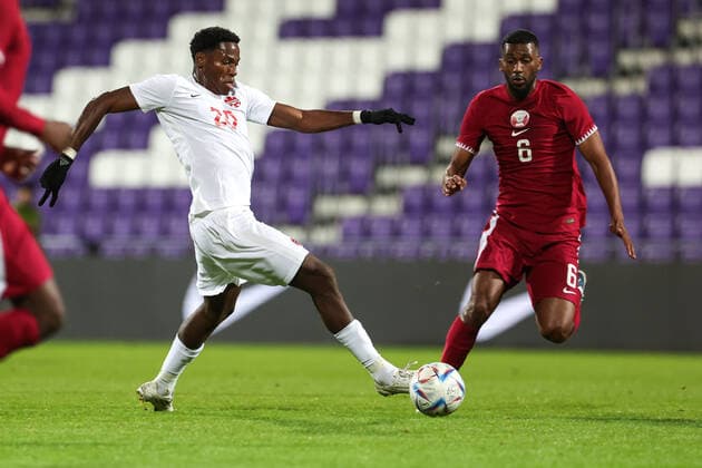 SOCCER - QAT vs CAN, test match VIENNA,AUSTRIA,23.SEP.22 - SOCCER - International test match, Qatar vs Canada. Image shows Jonathan David (CAN) and Almoez Ali Zainelabdeen Abdulla (QAT).  GEPAxpictures xArminxRauthner