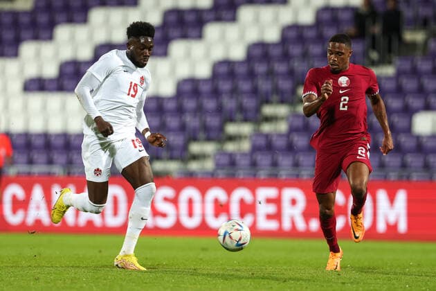 SOCCER - QAT vs CAN, test match VIENNA,AUSTRIA,23.SEP.22 - SOCCER - International test match, Qatar vs Canada. Image shows Alphonso Davies (CAN) and Pedro Miguel Correia (QAT).  GEPAxpictures xArminxRauthner