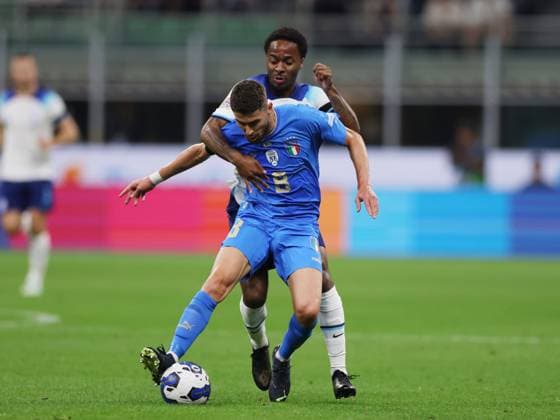 Milan, Italy, 23rd September 2022. Jorginho of Italy tackled by Raheem Sterling of England during the UEFA Nations League match at Stadio Giuseppe Meazza, Milan. Picture credit should read: Jonathan Moscrop Sportimage EDITORIAL USE ONLY. No use with unauthorised audio, video, data, fixture lists, club league logos or live services. Online in-match use limited to 120 images, no video emulation. No use in betting, games or single club league player publications. SPI-1892-0001