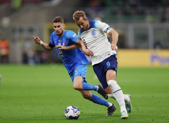 Milan, Italy, 23rd September 2022. Jorginho of Italy tussles with Harry Kane of England during the UEFA Nations League match at Stadio Giuseppe Meazza, Milan. Picture credit should read: Jonathan Moscrop Sportimage EDITORIAL USE ONLY. No use with unauthorised audio, video, data, fixture lists, club league logos or live services. Online in-match use limited to 120 images, no video emulation. No use in betting, games or single club league player publications. SPI-1892-0005