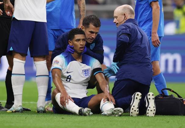 Milan, Italy, 23rd September 2022. Jude Bellingham of England gets checked over during the UEFA Nations League match at Stadio Giuseppe Meazza, Milan. Picture credit should read: Jonathan Moscrop Sportimage EDITORIAL USE ONLY. No use with unauthorised audio, video, data, fixture lists, club league logos or live services. Online in-match use limited to 120 images, no video emulation. No use in betting, games or single club league player publications. SPI-1892-0024