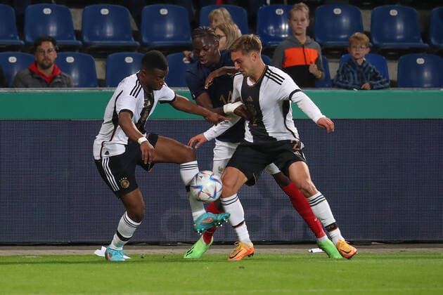 23 09 2022, xgox, football U21 Laenderspiel, Germany France emspor, v l Youssoufa Moukoko Germany, 11 , Castello Lukeba France, 14 , Kilian Fischer Germany, 2 Zweikampf, Duel, Kampf, tackle DFL DFB REGULATIONS PROHIBIT ANY USE OF PHOTOGRAPHS as IMAGE SEQUENCES and or QUASI VIDEO Magdeburg