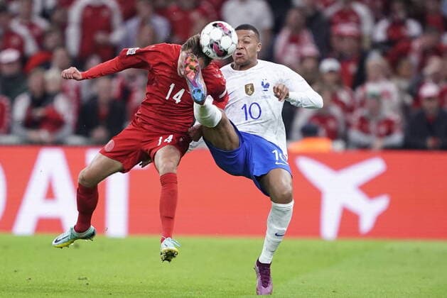 Denmarks Mikkel Damsgaard, left, and Frances Kylian Mbappé, right, during the UEFA Nations League League A – Group 1 soccer match between Denmark and France at Parken Stadium in Copenhagen, Denmark, Sunday September 25, 2022, Copenhagen Denmark  Copyright: LiselottexSabroex ScanpixID: 20220925-205334-L spdk20220925-205334-L