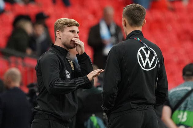 Timo Werner Germany Germany , Nico Schlotterbeck Germany with hand in front of mouth while talking London 26 09 2022 England vs Germany, UEFA Nations League, Matchday 6, Wembley Stadium