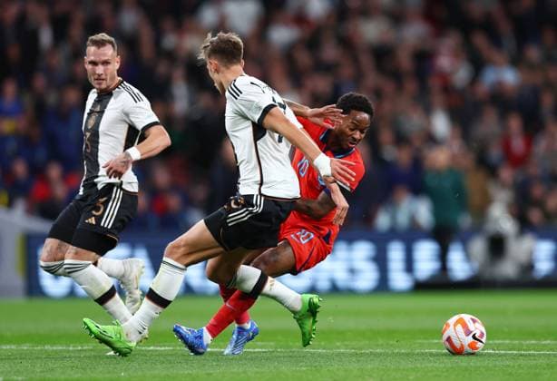 London, England, 26th September 2022. Raheem Sterling of England turns to find space past Niklas Sule of Germany to take a shot on goal during the UEFA Nations League match at Wembley Stadium, London. Picture credit should read: David Klein Sportimage EDITORIAL USE ONLY. No use with unauthorised audio, video, data, fixture lists, club league logos or live services. Online in-match use limited to 120 images, no video emulation. No use in betting, games or single club league player publications. SPI-1909-0045