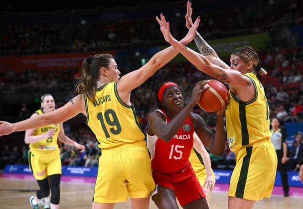 BASKETBALL WOMENS WORLD CUP 3RD, Laeticia Amihere (centre) of Canada in action against Sara Blicavs (left) and Cayla George (right) of Australia during the 2022 FIBA Women s Basketball World Cup 3rd Place match between Australia and Canada at Qudos Bank Arena in Sydney, Saturday, October 1, 2022. ( NO ARCHIVING, EDITORIAL USE ONLY, NO USE IN BOOKS WITHOUT CONSENT SYDNEY NEW SOUTH WALES AUSTRALIA  Copyright: xJAMESxGOURLEYx 20221001001709919673