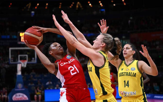 BASKETBALL WOMENS WORLD CUP 3RD, Nirra Fields (left) of Canada is blocked by Kristy Wallace (centre) and Marianna Tolo (right) of Australia during the 2022 FIBA Women s Basketball World Cup 3rd Place match between Australia and Canada at Qudos Bank Arena in Sydney, Saturday, October 1, 2022. ( NO ARCHIVING, EDITORIAL USE ONLY, NO USE IN BOOKS WITHOUT CONSENT SYDNEY NEW SOUTH WALES AUSTRALIA  Copyright: xJAMESxGOURLEYx 20221001001709921064