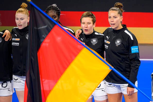 Handball, women international match France Germany Alina Grijseels Germany Dortmund , Emily Boelk Bölk Germany Ferencvaros Budapest during the national anthem with the flag Nancy Palais des Sports Jean Weille France