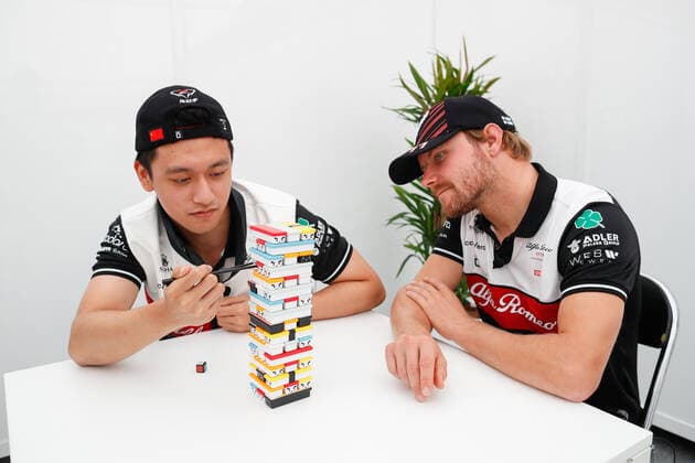 ZHOU Guanyu (chi), Alfa Romeo F1 Team ORLEN C42, BOTTAS Valtteri (fin), Alfa Romeo F1 Team ORLEN C42, portrait playing Sushi Jenga game during the Formula 1 Honda Japanese Grand Prix 2022, 18th round of the 2022 FIA Formula One World Championship, WM, Weltmeisterschaft from October 7 to 9, 2022 on the Suzuka International Racing Course, in Suzuka, Mie Prefecture, Japan - F1 - JAPANESE GRAND PRIX 2022 DPPI Panoramic  00122041__V2_5329
