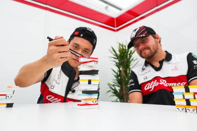 ZHOU Guanyu (chi), Alfa Romeo F1 Team ORLEN C42, BOTTAS Valtteri (fin), Alfa Romeo F1 Team ORLEN C42, portrait playing Sushi Jenga game during the Formula 1 Honda Japanese Grand Prix 2022, 18th round of the 2022 FIA Formula One World Championship, WM, Weltmeisterschaft from October 7 to 9, 2022 on the Suzuka International Racing Course, in Suzuka, Mie Prefecture, Japan - F1 - JAPANESE GRAND PRIX 2022 DPPI Panoramic  00122041_AV6_7057