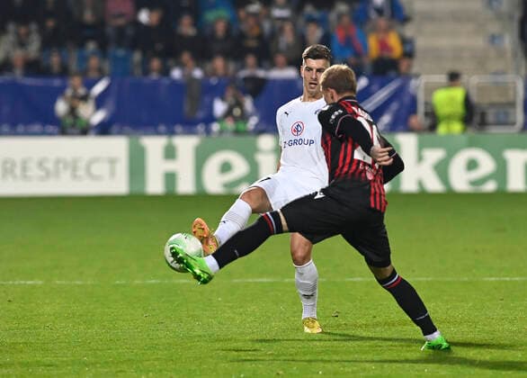 Michal Tomic of Slovacko, left, and Melvin Bard of Nice in action during the UEFA Conference League, 3rd round, Group D match 1. FC Slovacko vs OGC Nice in Uherske Hradiste, Czech Republic, October 6, 2022. (CTKxPhoto DaliborxGluck) CTKPhotoP2022100609177  dg005A