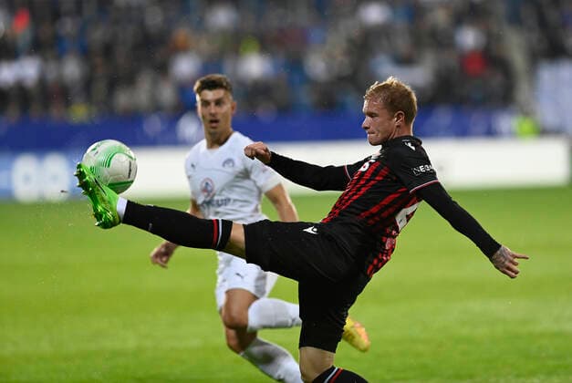 Michal Tomic of Slovacko, left, and Melvin Bard of Nice in action during the UEFA Conference League, 3rd round, Group D match 1. FC Slovacko vs OGC Nice in Uherske Hradiste, Czech Republic, October 6, 2022. (CTKxPhoto DaliborxGluck) CTKPhotoP2022100609250  dg010