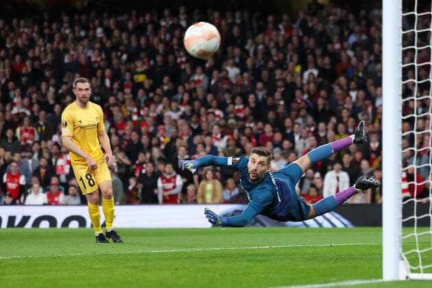 Mandatory Credit: Photo by Simon Dael Shutterstock (13442648v) Nikita Khaikin of Bodø Glimt is beaten by the shot of Kieran Tierney of Arsenal but hits the post Arsenal v Bodo Glimt, UEFA Europa League, Group A, Football, Emirates Stadium, London, UK - 06 Oct 2022 EDITORIAL USE ONLY No use with unauthorised audio, video, data, fixture lists, club league logos or live services. Online in-match use limited to 120 images, no video emulation. No use in betting, games or single club league player publications. Arsenal v Bodo Glimt, UEFA Europa League, Group A, Football, Emirates Stadium, London, UK - 06 Oct 2022 EDITORIAL USE ONLY No use with unauthorised audio, video, data, fixture lists, club league logos or live services. Online in-match use limited to 120 images, no video emulation. No use in betting, games or single club league player publications. Copyright: xSimonxDael Shutterstockx 13442648v