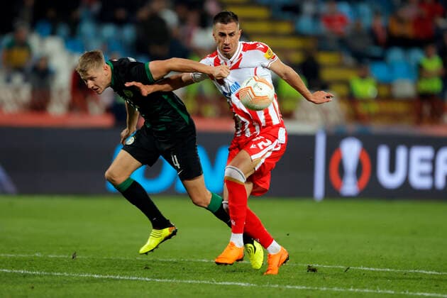 (221007) -- BELGRADE, Oct. 7, 2022 -- Aleksandar Pesic (R) of Crvena Zvezda vies with Mats Knoester of Ferencvaros during an UEFA Europa League match between Crvena Zvezda and Ferencvaros in Belgrade, Serbia, on Oct 6, 2022. (Photo by Xinhua) (SP)SERBIA-BELGRADE-FOOTBALL-UEFA EUROPA LEAGUE-CRVENA ZVEZDA VS FERENCVAROS PredragxMilosavljevic 