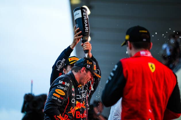 VERSTAPPEN Max (ned), Red Bull Racing RB18, celebrating race victory and World Championship, WM, Weltmeisterschaft on the podium with LECLERC Charles (mco), Scuderia Ferrari F1-75, and PEREZ Sergio (mex), Red Bull Racing RB18, portrait during the Formula 1 Honda Japanese Grand Prix 2022, 18th round of the 2022 FIA Formula One World Championship from Octobre 7 to 9, 2022 on the Suzuka International Racing Course, in Suzuka, Mie Prefecture, Japan - F1 - JAPANESE GRAND PRIX 2022 - RACE DPPI Panoramic  20221009_G00D1916