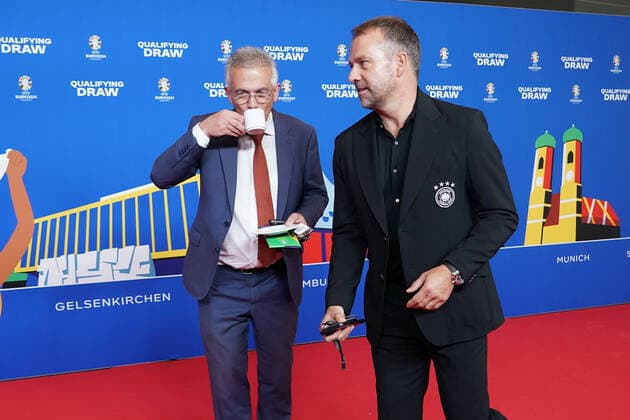 National coach Hansi Flick Germany Germany and Frankfurts mayor Peter Feldmann once again with a faux pas with coffee cup on the red carpet for the draw of the qualifying groups for the European Championship 2024 in the Frankfurt Festhalle 09 10 2022 EURO2024 Qualifying Draw EM 2024 Draw of the qualifying groups, Festhalle Frankfurt