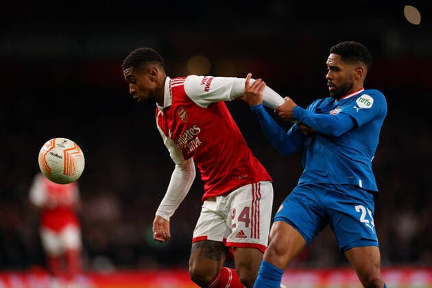 20th October 2022; Emirates Stadium, London, England; Europa League Football, Arsenal versus PSV Eindhoven; Reiss Nelson of Arsenal is under pressure from Phillipp Mwene of PSV Eindhoven  ActionPlus12438109 ShaunxBrooks