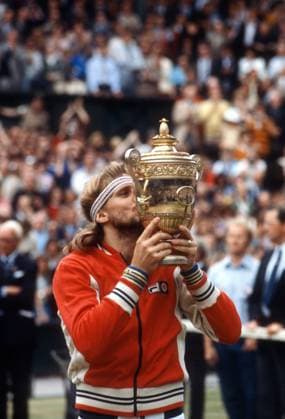 Bjorn Borg winning his fifth consecutive Wimbledon final. Bjorn Borg kisses the Wimbledon trophy after winning his fifth consecutive Wimbledon title by defeating John McEnroe in five sets on July 5, 1980. London United Kingdom Copyright: xAdamxStoltmanx Image 0045