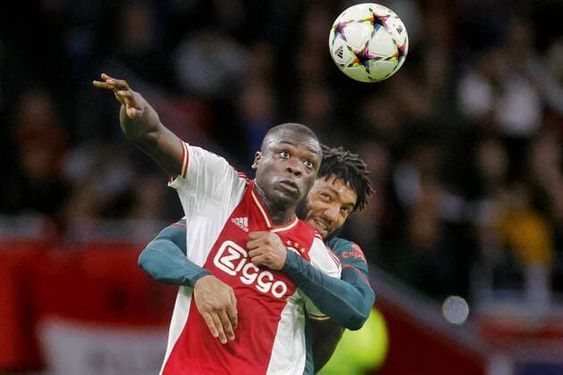 AMSTERDAM, 26-10-2022, JohanCruyff Arena . Season 2022-2023. Champions League game between Ajax and Liverpool FC 0-3. Ajax player Brian Brobbey and Liverpool player Joe Gomez Ajax - Liverpool  x19022665x Copyright: