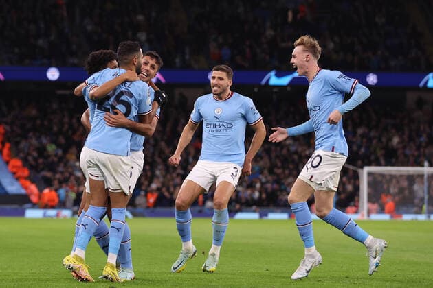 MANCHESTER, ENGLAND - NOVEMBER 02: Manchester City players celebrate the goal by Rico Lewis during the UEFA Champions League group G match between Manchester City and Sevilla FC at Etihad Stadium on November 2, 2022 in Manchester, United Kingdom. SPO 