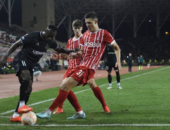 Owusu Kwabena of Qaraba? FK hold the ball under pressure from Keven Schlotterbeck of SC Freiburg during the UEFA Europa League Group G match between Qaraba? FK and SC Freiburg at The Tofiq Bahramov Republican Stadium in Baku, Azerbaijan  Copyright: xx