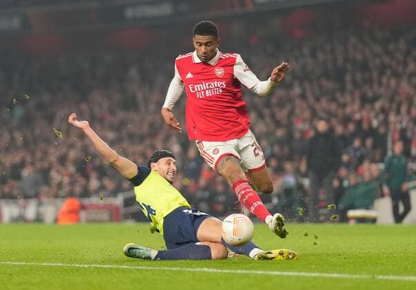 Mandatory Credit: Photo by Dave Shopland Shutterstock (13602543ay) Reiss Nelson of Arsenal is tackled by Nicola Katic of FC Zurich Arsenal v FC Zurich, UEFA Europa League, Group A, Football, Emirates Stadium, London, UK - 03 Nov 2022 EDITORIAL USE ONLY No use with unauthorised audio, video, data, fixture lists, club league logos or live services. Online in-match use limited to 120 images, no video emulation. No use in betting, games or single club league player publications. Arsenal v FC Zurich, UEFA Europa League, Group A, Football, Emirates Stadium, London, UK - 03 Nov 2022 EDITORIAL USE ONLY No use with unauthorised audio, video, data, fixture lists, club league logos or live services. Online in-match use limited to 120 images, no video emulation. No use in betting, games or single club league player publications. Copyright: xDavexShopland Shutterstockx 13602543ay