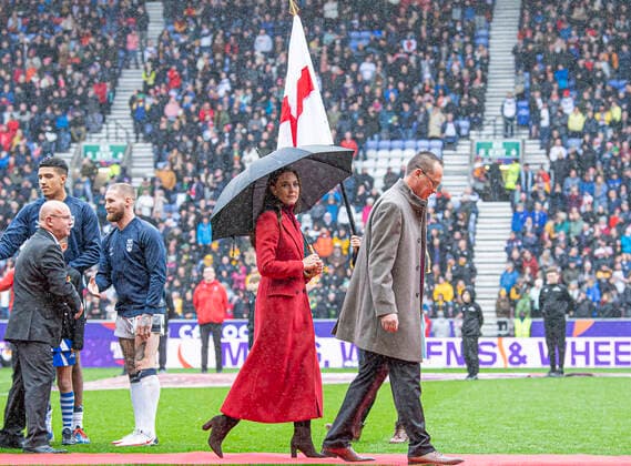 Picture by Allan McKenzie SWpix.com - 05 11 2022 - Rugby League - Rugby League World Cup 2021 - HRH The Princess of Wales - England v Papua New Guinea - DW Stadium, Wigan, England - HRH Princess of Wales leaves the field of play with Rugby league World Cup Chief Executive Jon Dutton after meeting the teams ahead of the Rugby League World Cup Quarter final between England and Papua New Guinea.. HRH The Princess of Wales SWP-1907-0035