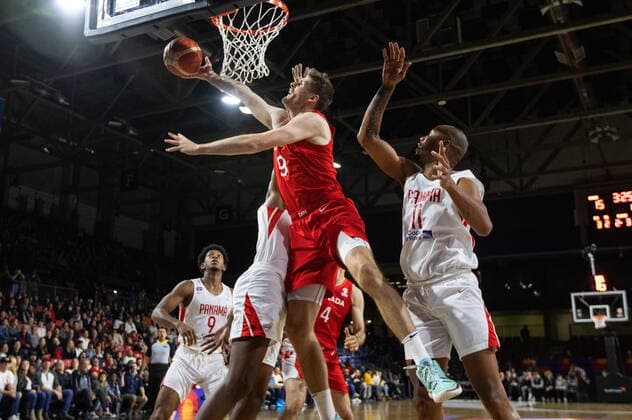 November 13, 2022, EDMONTON, AB, CANADA: Canada s Conor Morgan (9) goes up for the shot past Panama s Ernesto Ogivie (11) during first half FIBA World Cup Qualifiers action in Edmonton, Sunday, Nov. 13, 2022. Canada News - November 13, 2022  - ZUMAc35_ 20221113_zaf_c35_135 Copyright: xJasonxFransonx