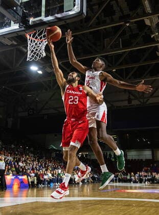 November 13, 2022, EDMONTON, AB, CANADA: Canada s Phil Scrubb (23) get the shot away as Panama s Eric Romero (16) during first half FIBA World Cup Qualifiers action in Edmonton, Sunday, Nov. 13, 2022. Canada News - November 13, 2022  - ZUMAc35_ 20221113_zaf_c35_137 Copyright: xJasonxFransonx
