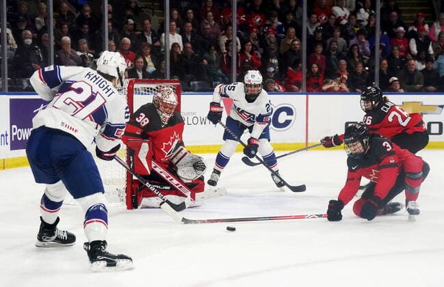 November 15, 2022, Kelowna, BC, Canada: United States Hilary Knight (21) passes to Alex Carpenter (25) as Canada goaltender Emerance Maschmeyer (38), Jocelyne Larocque (3) and Emily Clark (26) defend during third period Rivalry Series hockey action in Kelowna, B.C., Tuesday, Nov. 15, 2022. Canada News - November 15, 2022 - ZUMAc35_ 20221115_zaf_c35_205 Copyright: xJessexJohnstonx