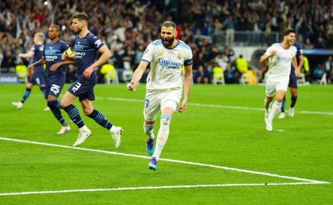 Mandatory Credit: Photo by Javier Garcia Shutterstock (12923462cn) Karim Benzema of Real Madrid celebrates after scoring his decisive goal from the penalty spot 3-1 Real Madrid v Manchester City, UEFA Champions League, Semi Final, Second Leg, Football, Santiago Bernabeu, Madrid, Spain - 04 May 2022 EDITORIAL USE ONLY No use with unauthorised audio, video, data, fixture lists, club league logos or live services. Online in-match use limited to 120 images, no video emulation. No use in betting, games or single club league player publications. Real Madrid v Manchester City, UEFA Champions League, Semi Final, Second Leg, Football, Santiago Bernabeu, Madrid, Spain - 04 May 2022 EDITORIAL USE ONLY No use with unauthorised audio, video, data, fixture lists, club league logos or live services. Online in-match use limited to 120 images, no video emulation. No use in betting, games or single club league player publications. Copyright: xJavierxGarcia Shutterstockx 12923462cn