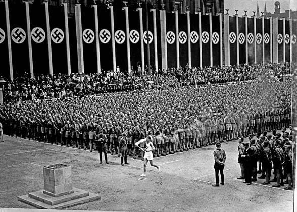 ARCHIVE 1936 Olympic opening ceremony in Berlin 1936 For the first time in history, the Olympic flame was carried in relay from Olympia in Greece to Berlin 28,000 Hitler Youth formed a column along the Via Triumphalis from the centre of Berlin to the Equestrian Field opening and closing day The last torch bearer is the German athlete Fritz Schilgen Opening ceremony for the Olympics in Berlin Torch bearer is the German athlete Fritz Schilgen Berlin GERMANY Olympics x1900x  Copyright: xTTxHISTORICALx OS-invigningen 1936
