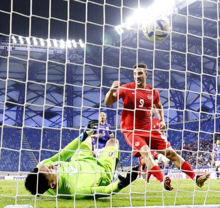 Football: Japan-Canada pre-World Cup friendly Lucas Cavallini of Canada scores past Japan goalkeeper Shuichi Gonda from the penalty spot in injury time in a friendly football match in Dubai on Nov. 17, 2022, ahead of the World Cup in Qatar. Canada won 2-1.  A14AA0001356518P 
