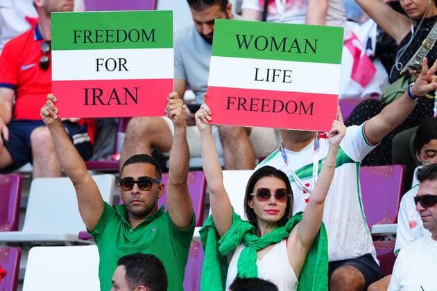 Mandatory Credit: Photo by Javier Garcia Shutterstock (13626340k) Iranian fans hold up banners. England v Iran, FIFA World Cup, WM, Weltmeisterschaft, Fussball 2022, Group B, Football, Khalifa International Stadium, Ar-Rayyan, Qatar - 21 Nov 2022 Editorial Use Only England v Iran, FIFA World Cup 2022, Group B, Football, Khalifa International Stadium, Ar-Rayyan, Qatar - 21 Nov 2022 Editorial Use Only  Copyright: xJavierxGarcia Shutterstockx 13626340k