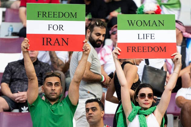 DOHA, QATAR - NOVEMBER 21: Iran fans hold up protest signs ahead of the FIFA World Cup, WM, Weltmeisterschaft, Fussball Qatar 2022 Group B match between England and IR Iran at Khalifa International Stadium on November 21, 2022 in Doha, Qatar.(Photo by Sebastian Frej) WCS  Copyright: xSebastianxFrejx