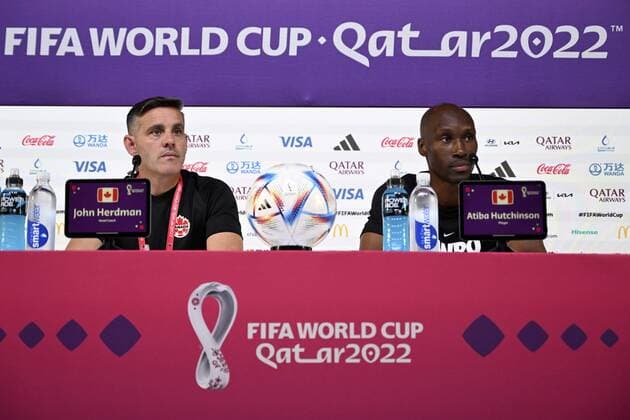 DOHA, QATAR - NOVEMBER 22 : Herdman John head coach of Canada & Hutchinson Atiba midfielder of Canada talking to the press during a press conference, PK, Pressekonferenz before the FIFA World Cup, WM, Weltmeisterschaft, Fussball Qatar 2022 Groupe F match between Belgium and Canada on November 22, 2022 in Doha, Qatar, 22 11 2022 ( Belgium v Canada - FIFA World Cup Qatar 2022 - Media Activities 22 11 2022 PhotoNews Panoramic 