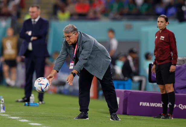 (221122) -- DOHA, Nov. 22, 2022 -- Gerardo Martino, head coach of Mexico, tries to catch the ball during the Group C match between Mexico and Poland of the 2022 FIFA World Cup, WM, Weltmeisterschaft, Fussball at Ras Abu Aboud (974) Stadium in Doha, Qatar, Nov. 22, 2022. ) (SP)QATAR-DOHA-2022 WORLD CUP-GROUP C-MEX VS POL WangxLili